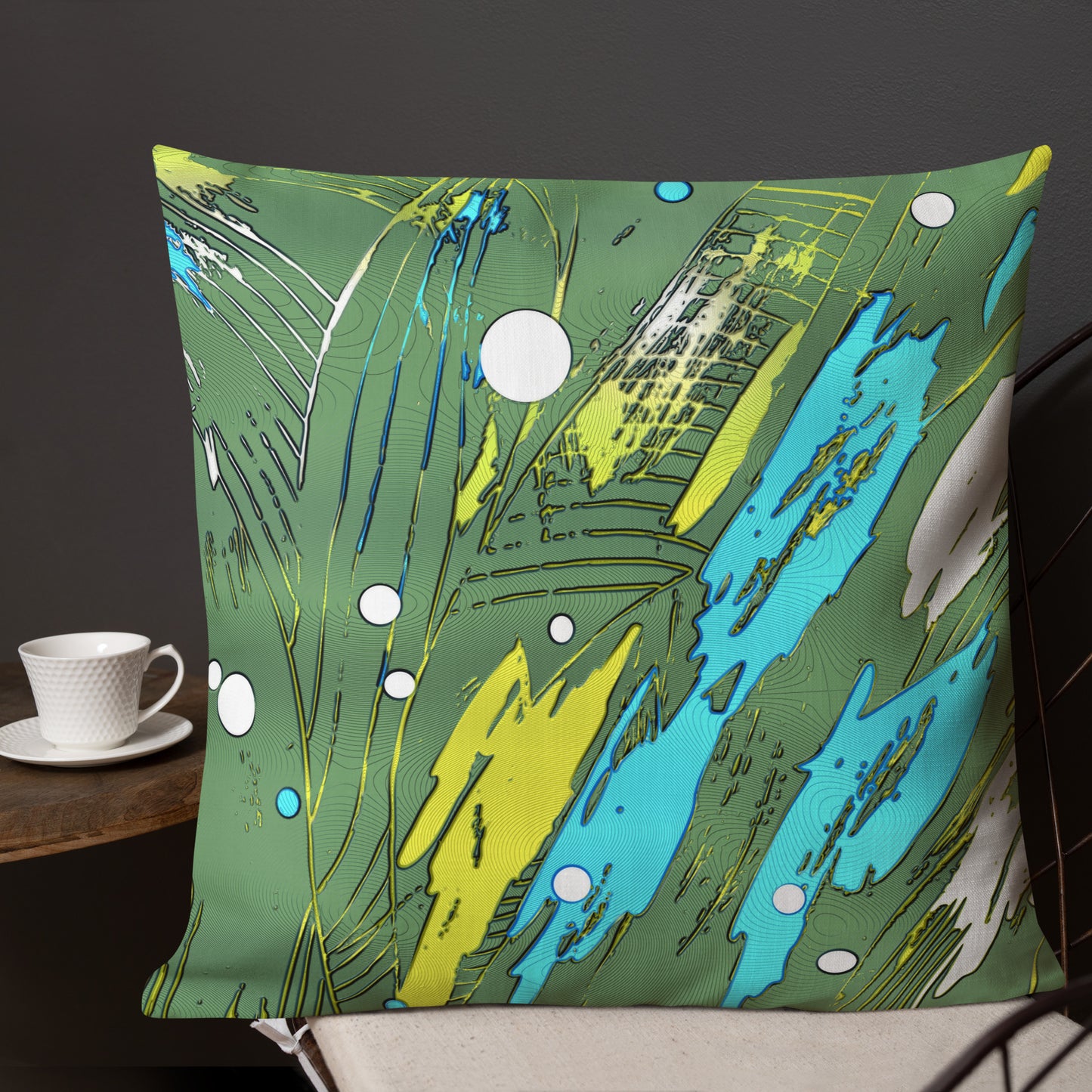 A square-shaped throw pillow with a geometric multicolor design in green, blue, and yellow, featuring a hidden zipper. bolster cushions